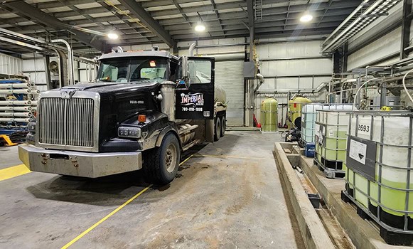 Truck in a warehouse with chemical containers