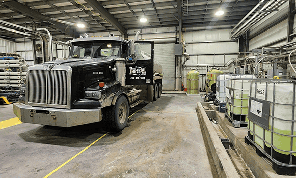 Truck in a warehouse with chemical containers