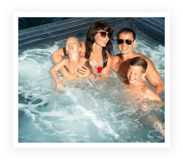 Family enjoying water fun in a hot tub.