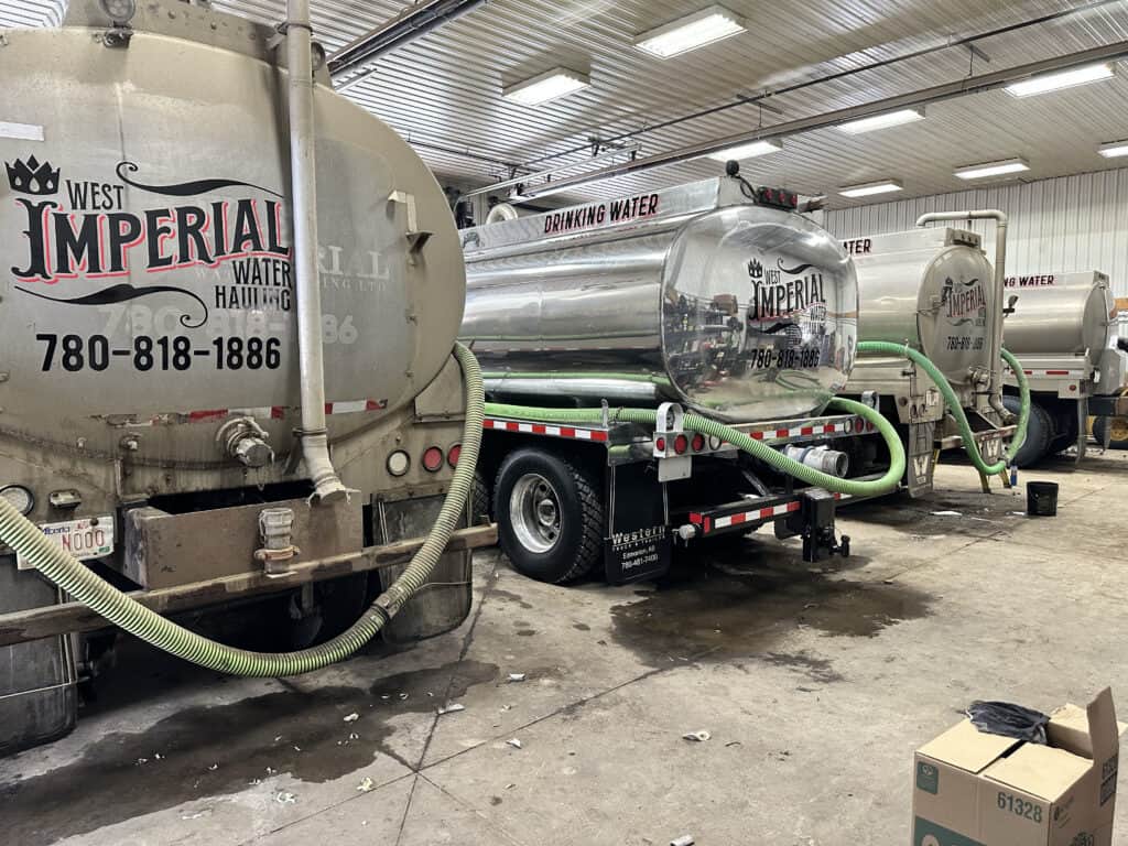 Water hauling trucks in a storage area